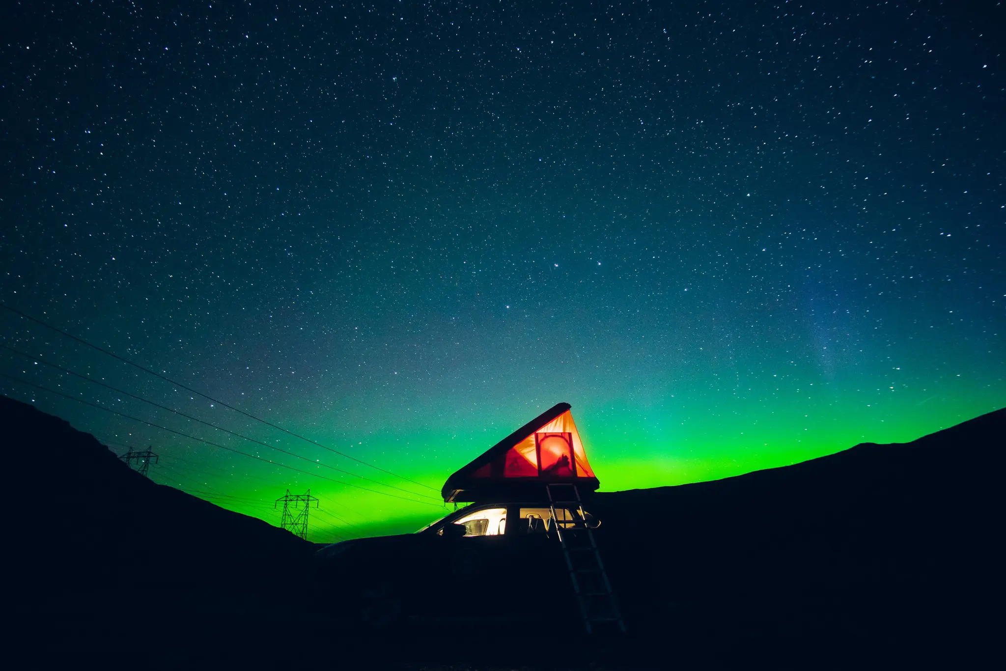 rooftop tent under northern lights in Norway