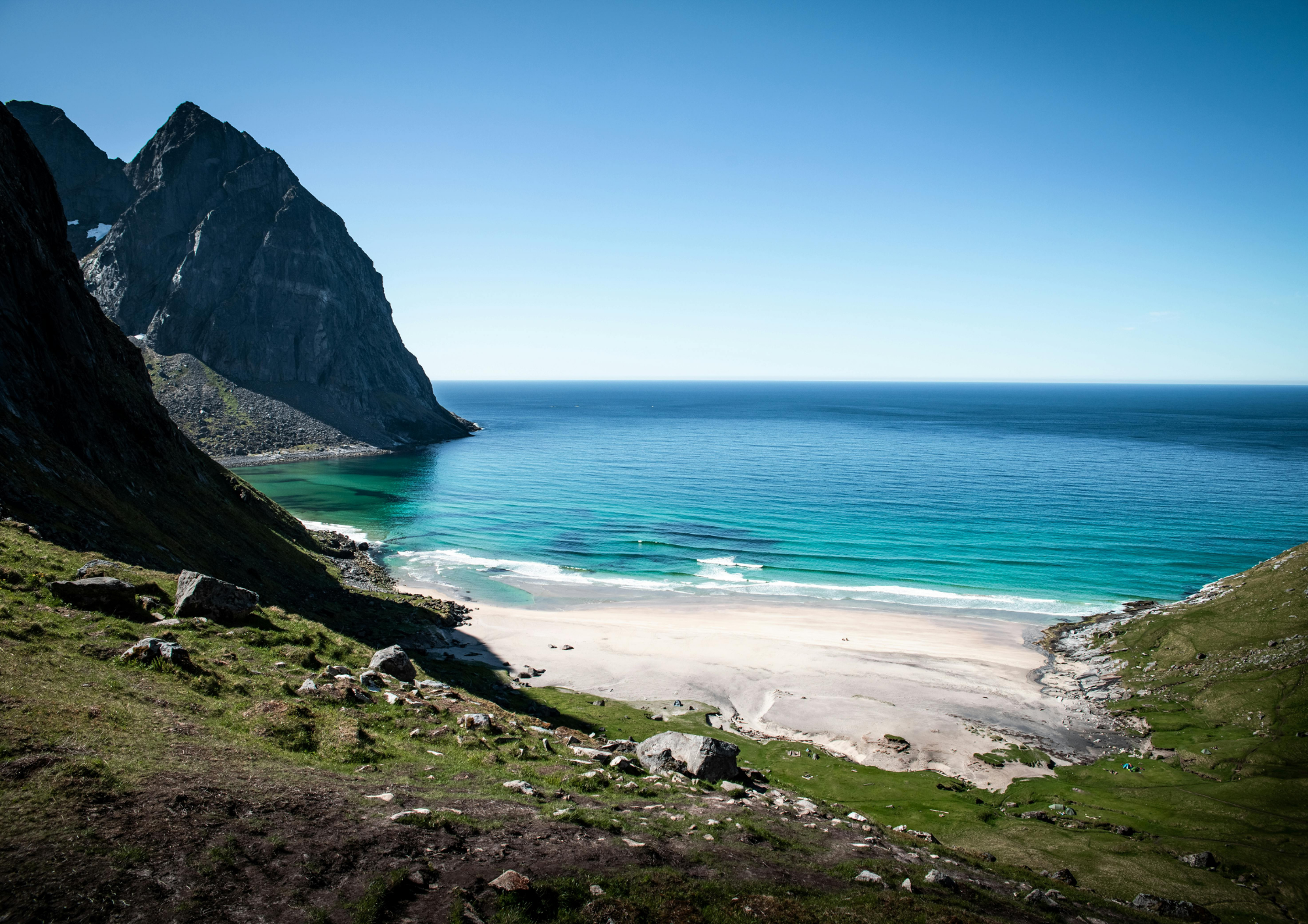 stunning Kvalvika Beach in Lofoten, Norway with turquoise water